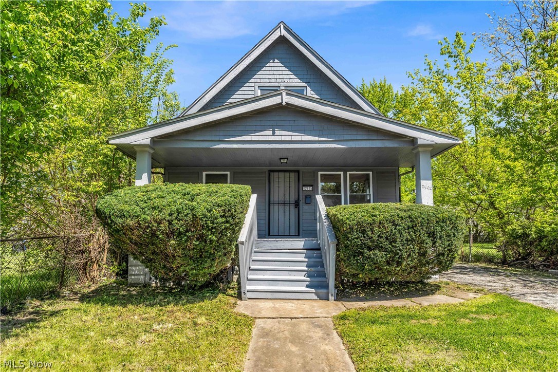 12905 Watterson Avenue Cleveland, OH 44105 - Photo 1 of 30 Gray siding exterior with a prominent front porch