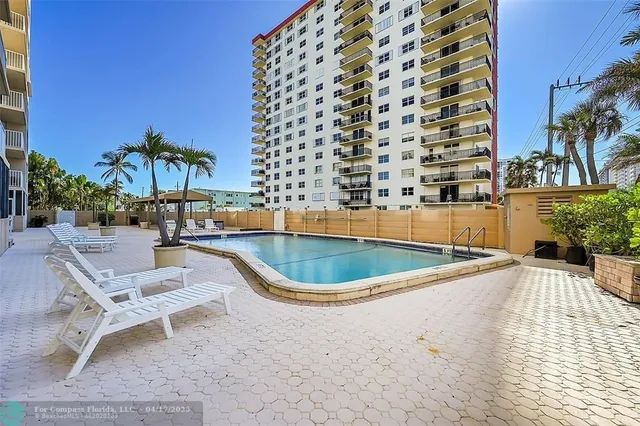 a view of a swimming pool with a lounge chairs