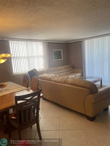 a bedroom with a bed and a mirror