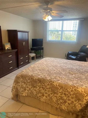 a bedroom with bed and window