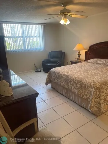 a bedroom with two beds and a window