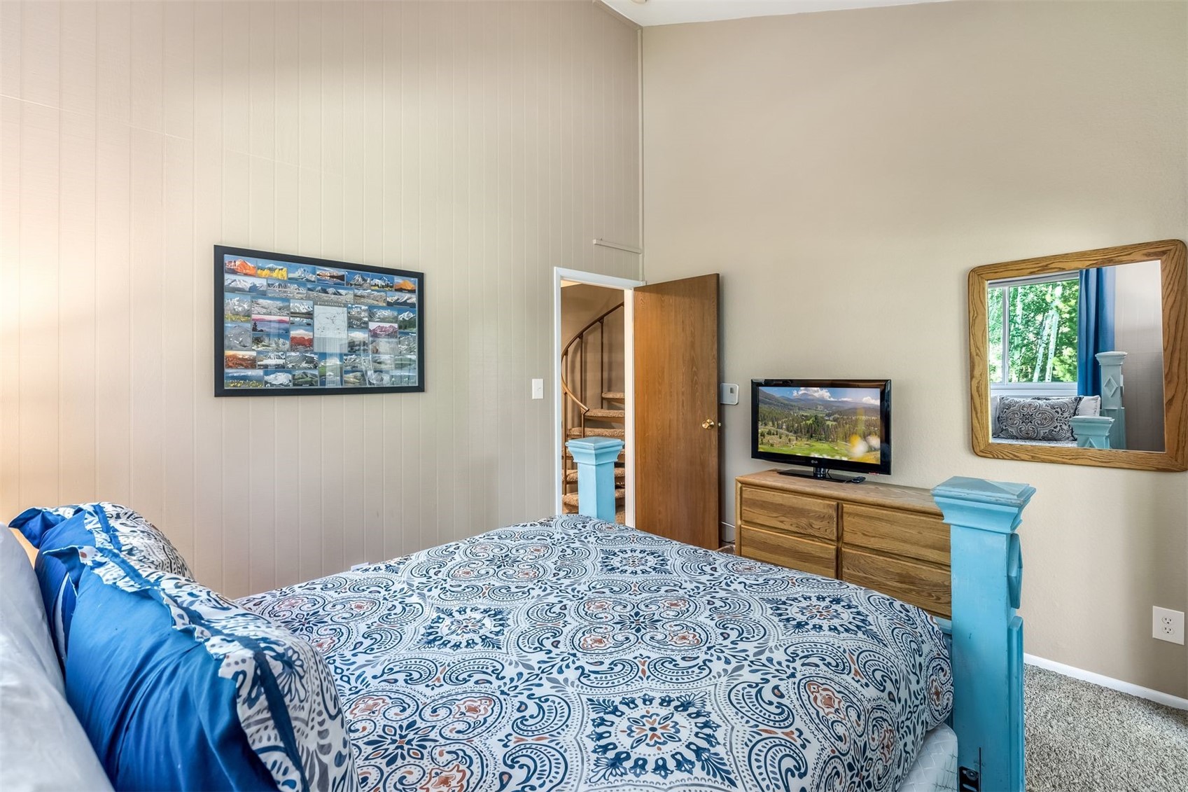 1977 Soda Ridge Road, Unit 1194 Keystone, CO 80435 - Photo 22 of 38 a bedroom with a bed and a flat screen tv