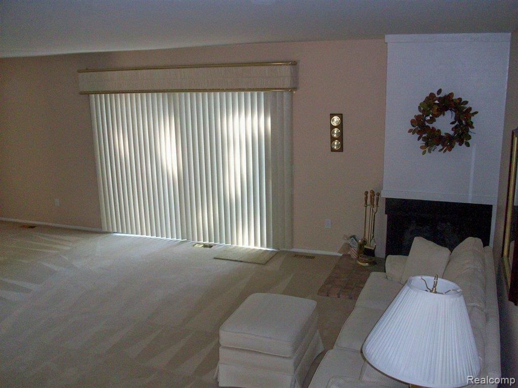 356 Willow Grove Lane, Unit 39 Rochester, MI 48307 - Photo 3 of 11 willowgrove living room 2.jpg