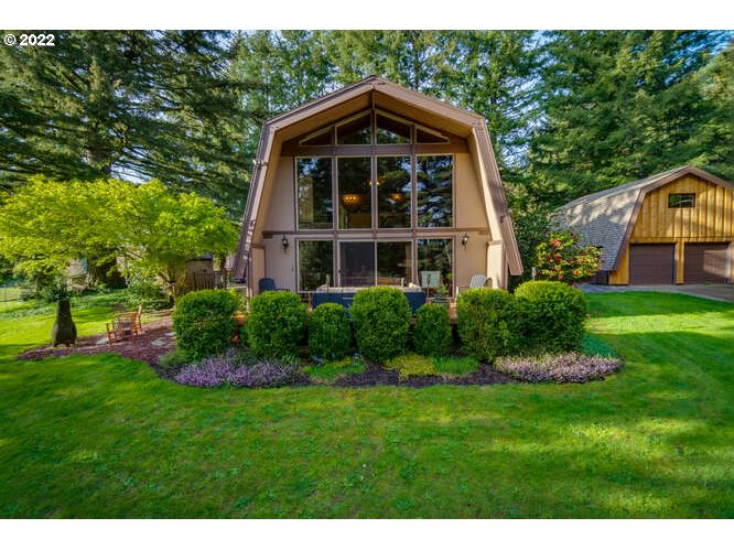 41945 Southeast Dover Court Sandy, OR 97055 - Photo 1 of 32 a front view of a house with a yard