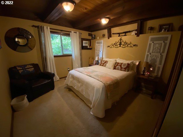 41945 Southeast Dover Court Sandy, OR 97055 - Photo 16 of 32 a bedroom with a bed and a mirror