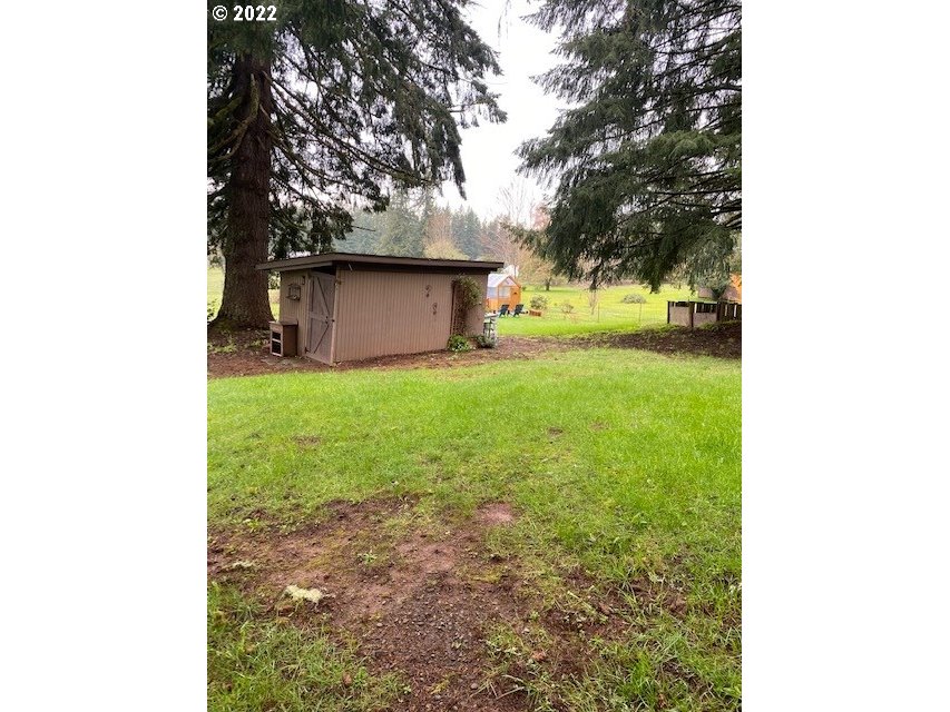 41945 Southeast Dover Court Sandy, OR 97055 - Photo 31 of 32 a view of a yard with large trees
