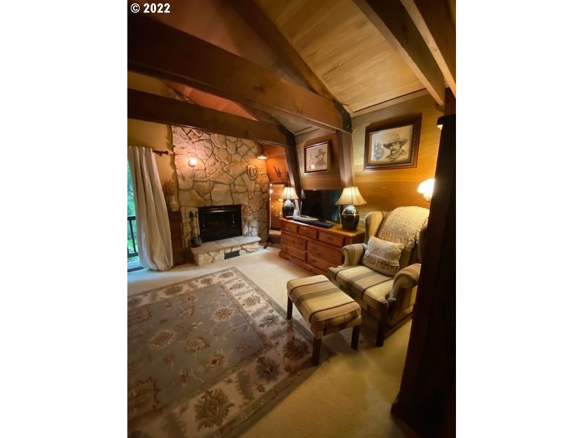 41945 Southeast Dover Court Sandy, OR 97055 - Photo 9 of 32 a living room with furniture and a fireplace
