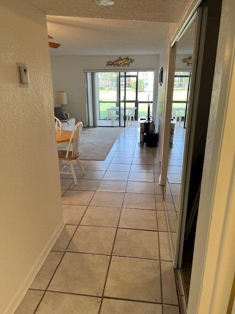 9233 Southwest 8th Street, Unit 119 Boca Raton, FL 33428 - Photo 22 of 42 a hallway with a window