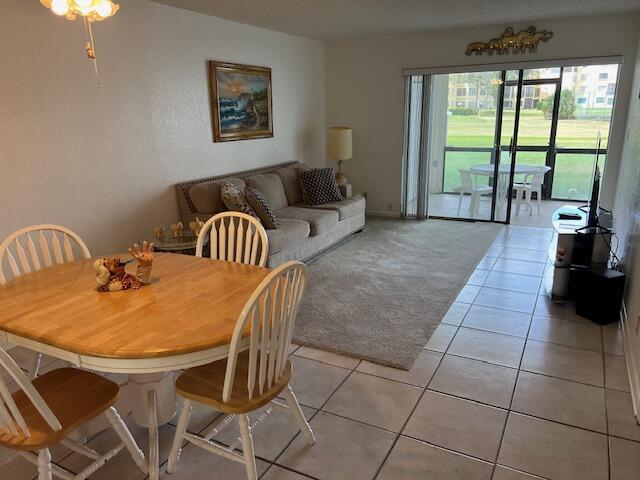 9233 Southwest 8th Street, Unit 119 Boca Raton, FL 33428 - Photo 26 of 42 a living room with a large window