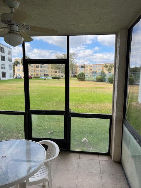 9233 Southwest 8th Street, Unit 119 Boca Raton, FL 33428 - Photo 27 of 42 a view of swimming pool with a large window