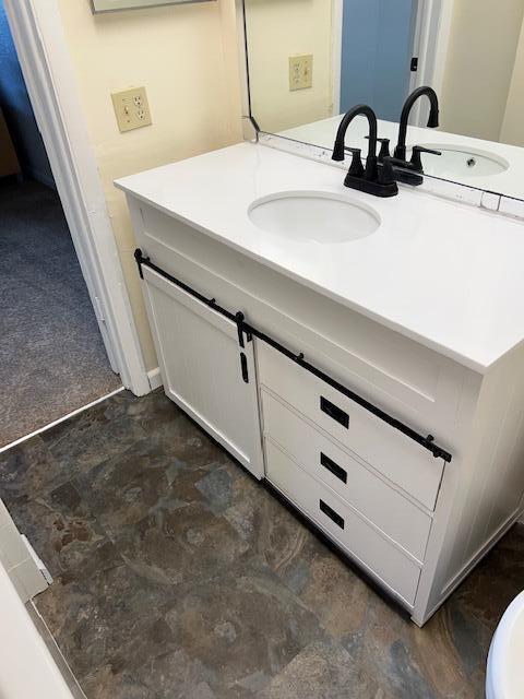 9233 Southwest 8th Street, Unit 119 Boca Raton, FL 33428 - Photo 36 of 42 a bathroom with a sink and a mirror