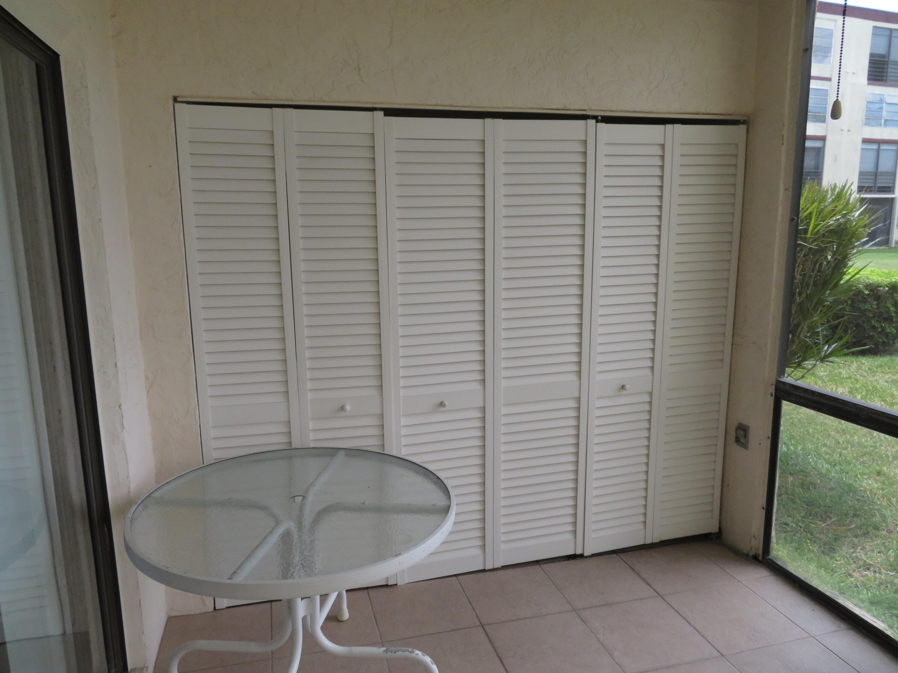 9233 Southwest 8th Street, Unit 119 Boca Raton, FL 33428 - Photo 39 of 42 a bathroom with a sink and a shower