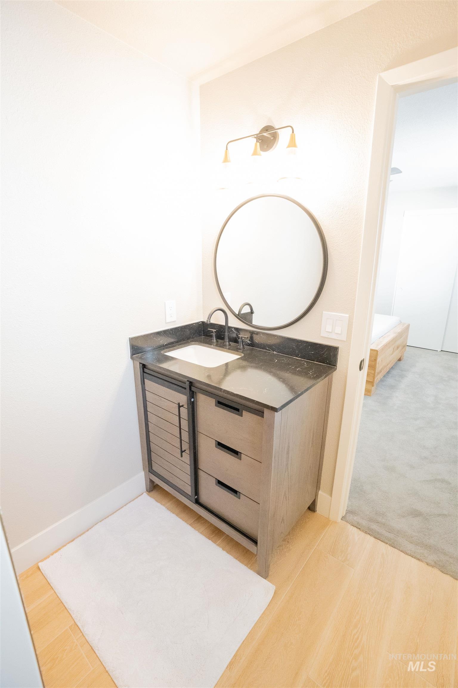 4667 Shawnee Way Boise, ID 83709 - Photo 19 of 24 Bathroom featuring vanity and light wood-type flooring