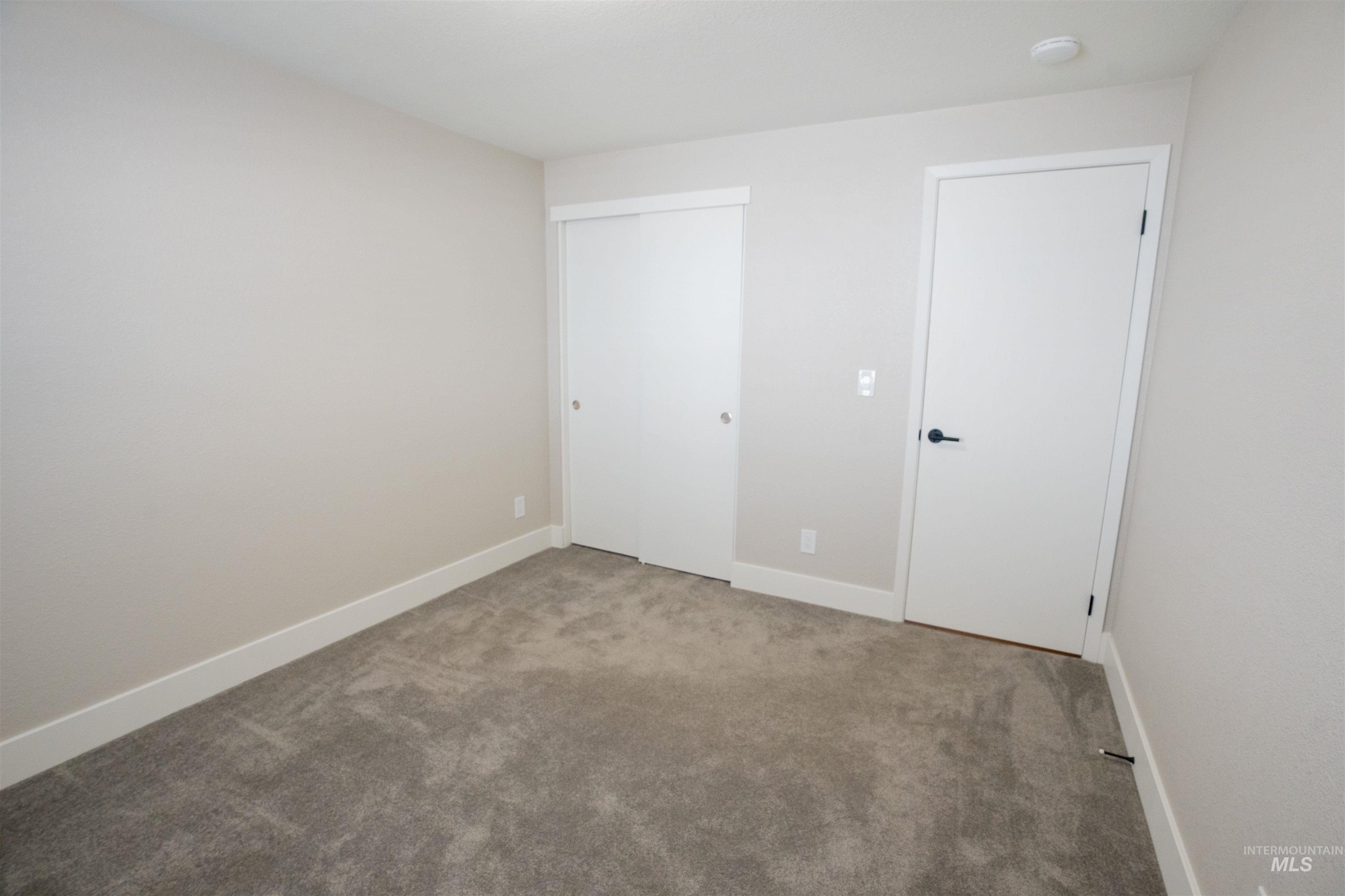 4667 Shawnee Way Boise, ID 83709 - Photo 20 of 24 Unfurnished bedroom with carpet and a closet