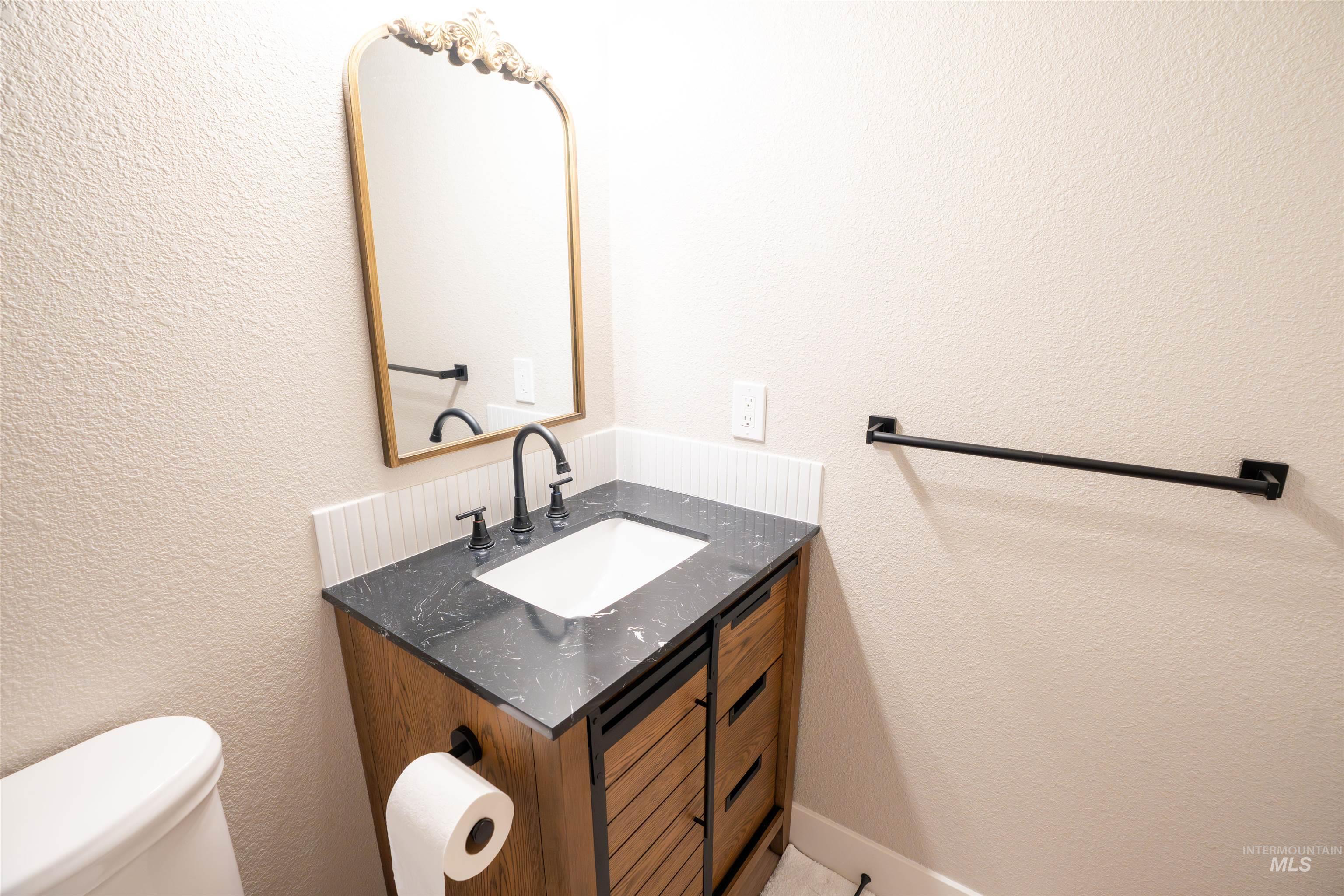 4667 Shawnee Way Boise, ID 83709 - Photo 22 of 24 Bathroom with a textured wall and vanity
