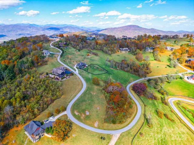 a view of a swimming pool with a table and chairs