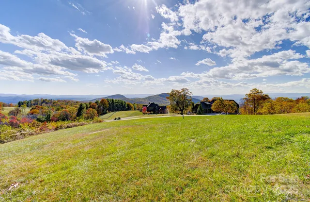 a view of a lake with houses in the back