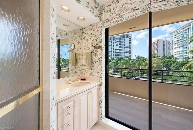 a bathroom with a sink and a large mirror