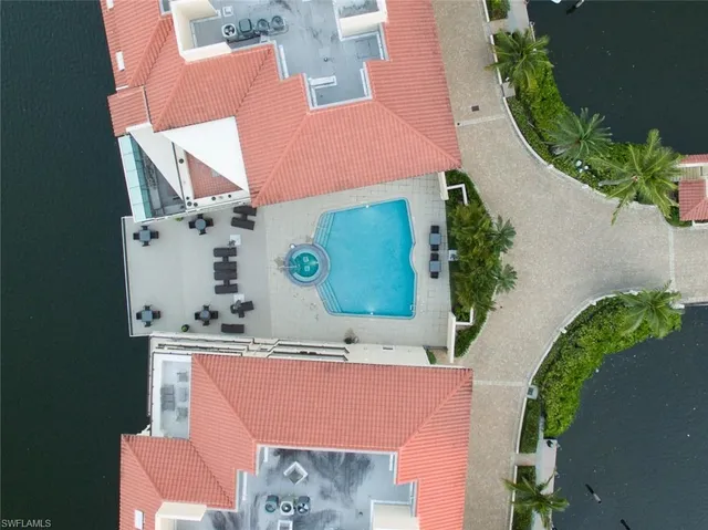 an aerial view of a house with a swimming pool