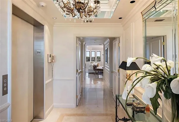 a view of a livingroom with furniture and entryway