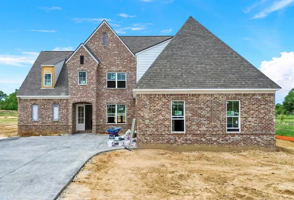 a view of house with yard