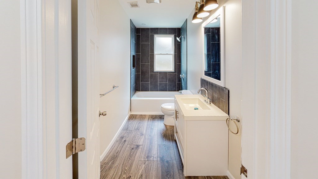 109 Deering Road, Unit 1 Boston, MA 02126 - Photo 6 of 12 view of a bathroom with a sink and mirror