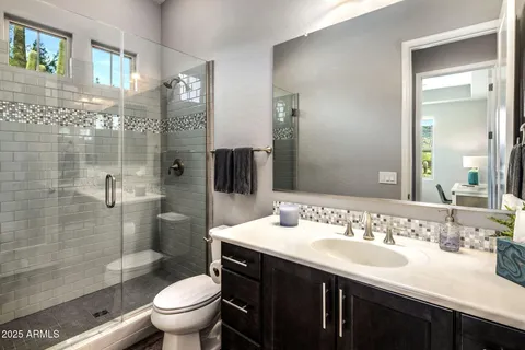 a bedroom with a bed and a lamp on table