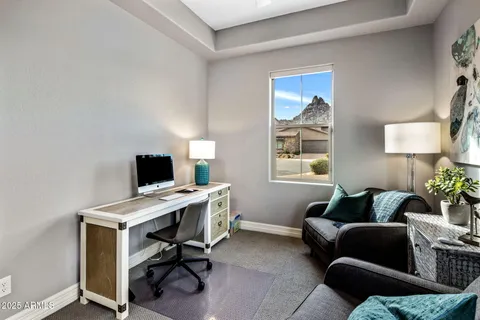 a living room with furniture a couch and a piano