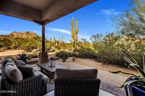 a utility room with granite countertop a sink and a washer dryer