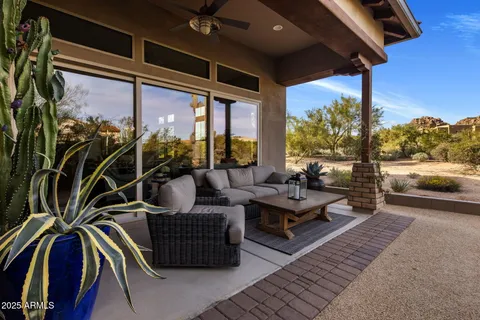 a outdoor space with patio the couches and dining table with garden view