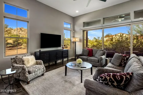 a living room with fireplace furniture and a flat screen tv