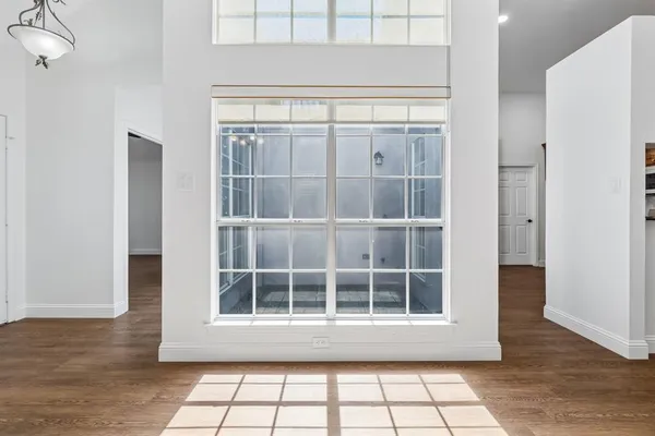 a view of empty room with windows