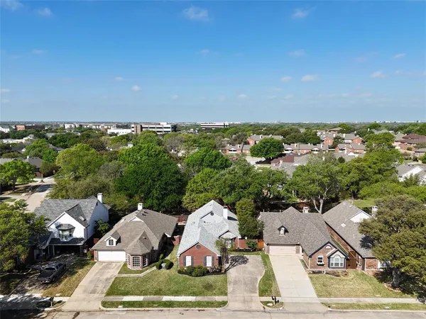 an aerial view of a house with a garden