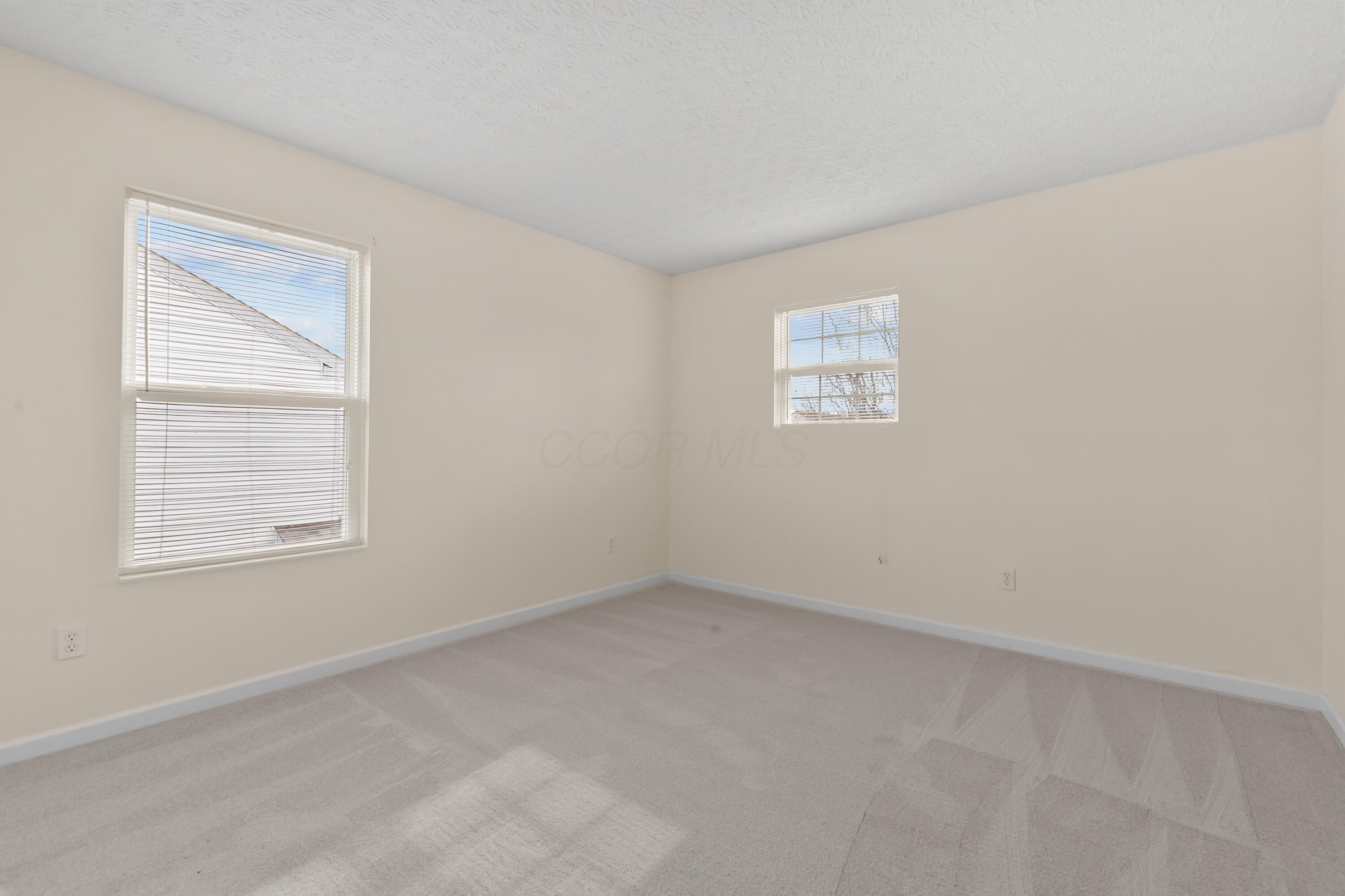 30 Tabilore Loop Delaware, OH 43015 - Photo 37 of 55 • New light sand carpet ~ 2025 • Ivory painted walls • Closet with bi-fold doors • Mini blinds