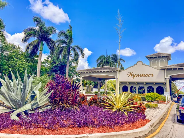 a view of a house with a fountain in front of it