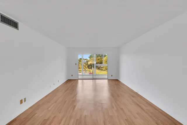 a view of an empty room and window