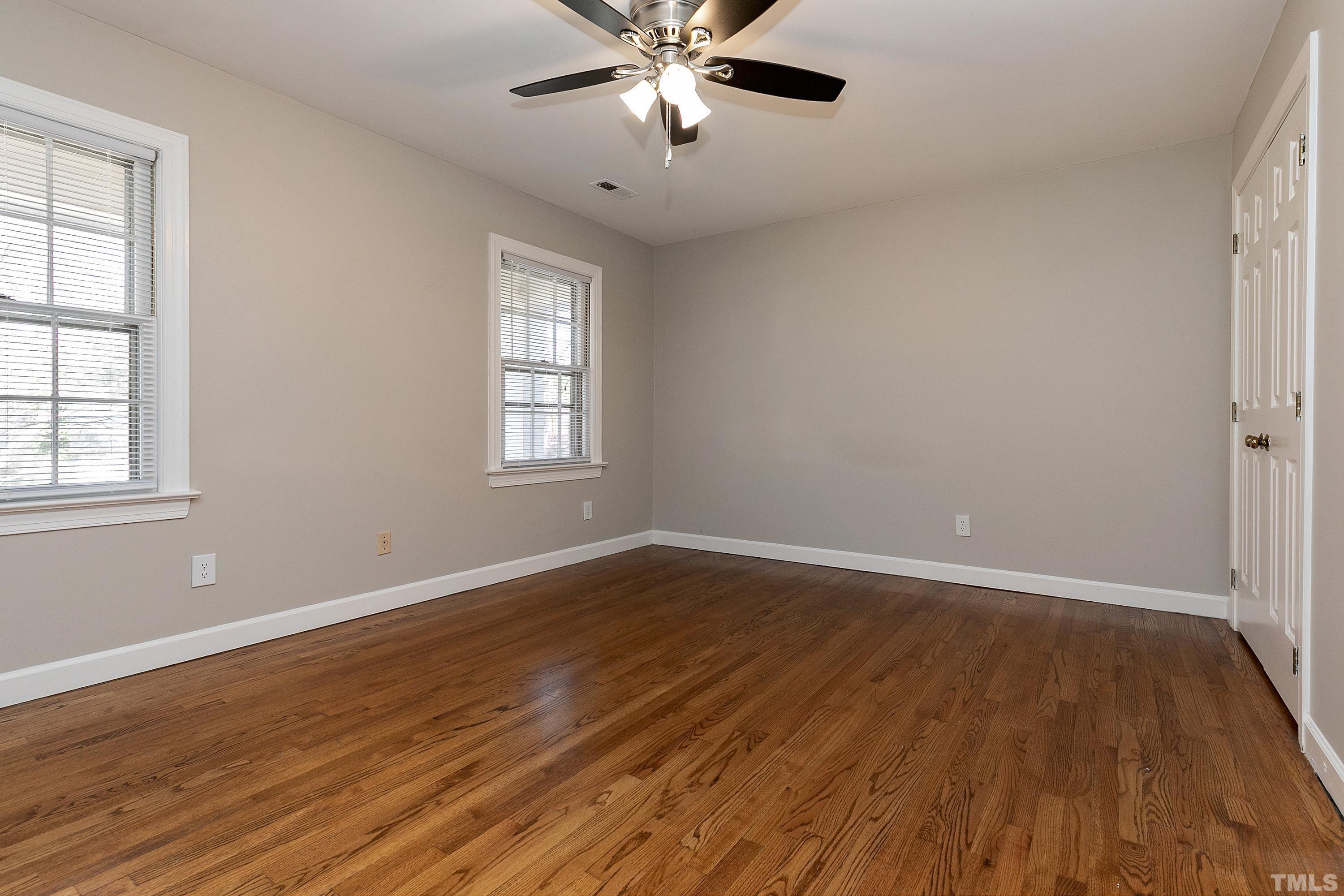 2012 Port Royal Road Raleigh, NC 27609 - Photo 19 of 36 a view of an empty room with wooden floor and a window