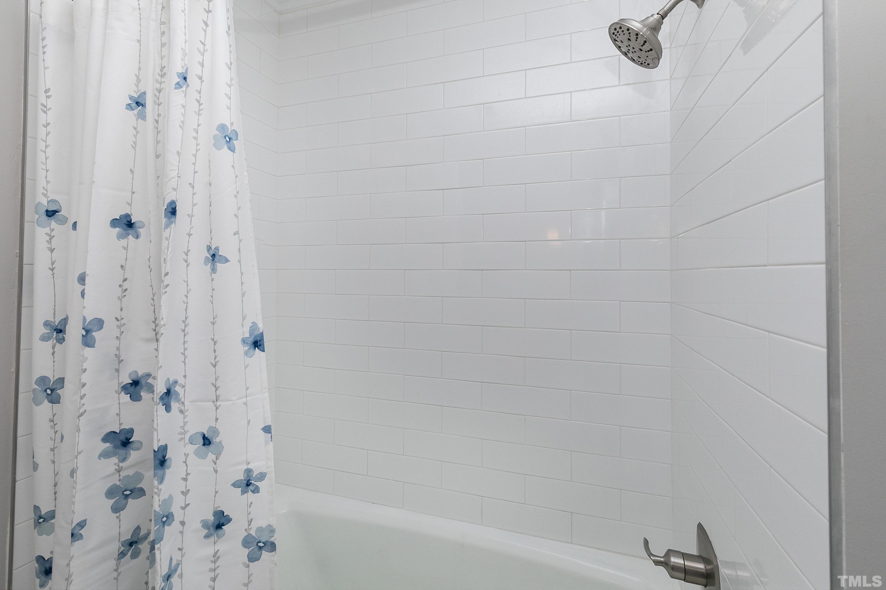 2012 Port Royal Road Raleigh, NC 27609 - Photo 27 of 36 a bathroom with a bathtub