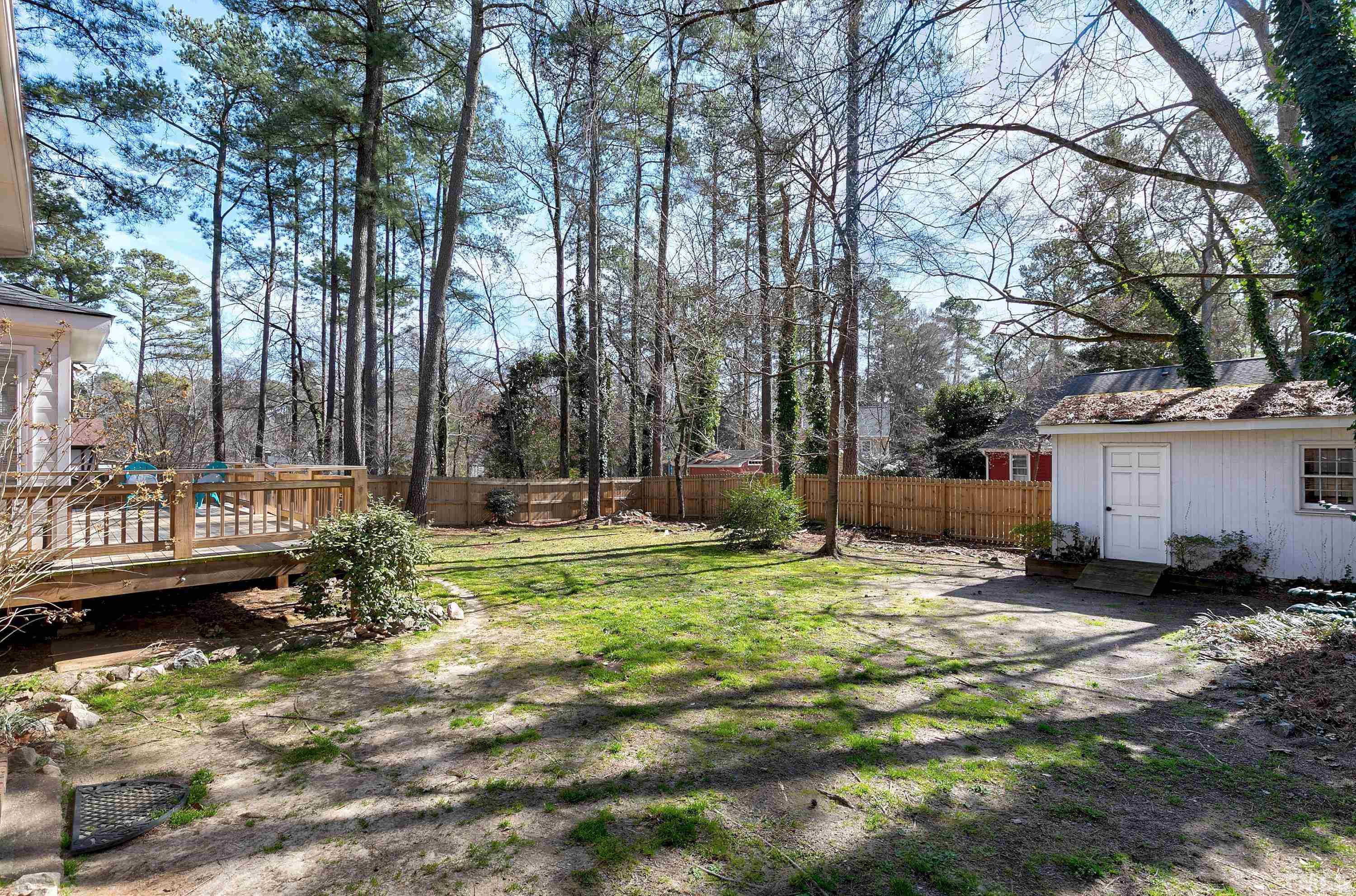 2012 Port Royal Road Raleigh, NC 27609 - Photo 32 of 36 a backyard of a house with barbeque oven and outdoor seating