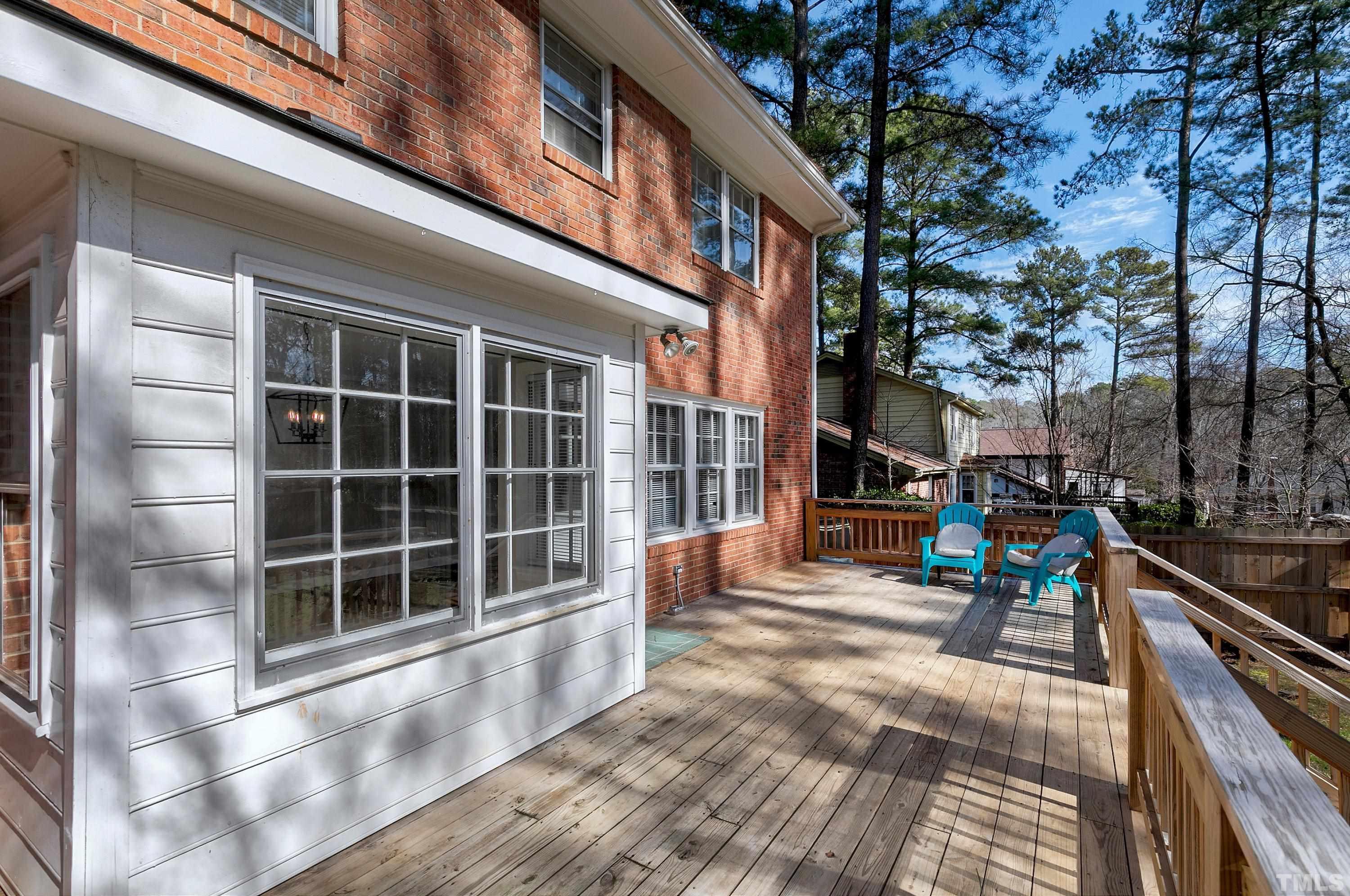 2012 Port Royal Road Raleigh, NC 27609 - Photo 34 of 36 a view of a balcony with chairs and a potted plant