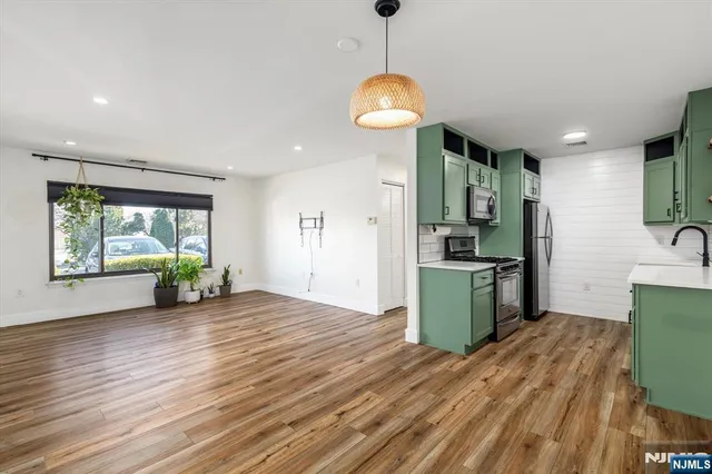 a view of a kitchen with a sink and a window