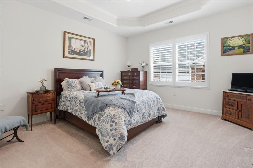 3328 Ivy Ridge Court Buford, GA 30519 - Photo 26 of 34 a bedroom with bed and a tv