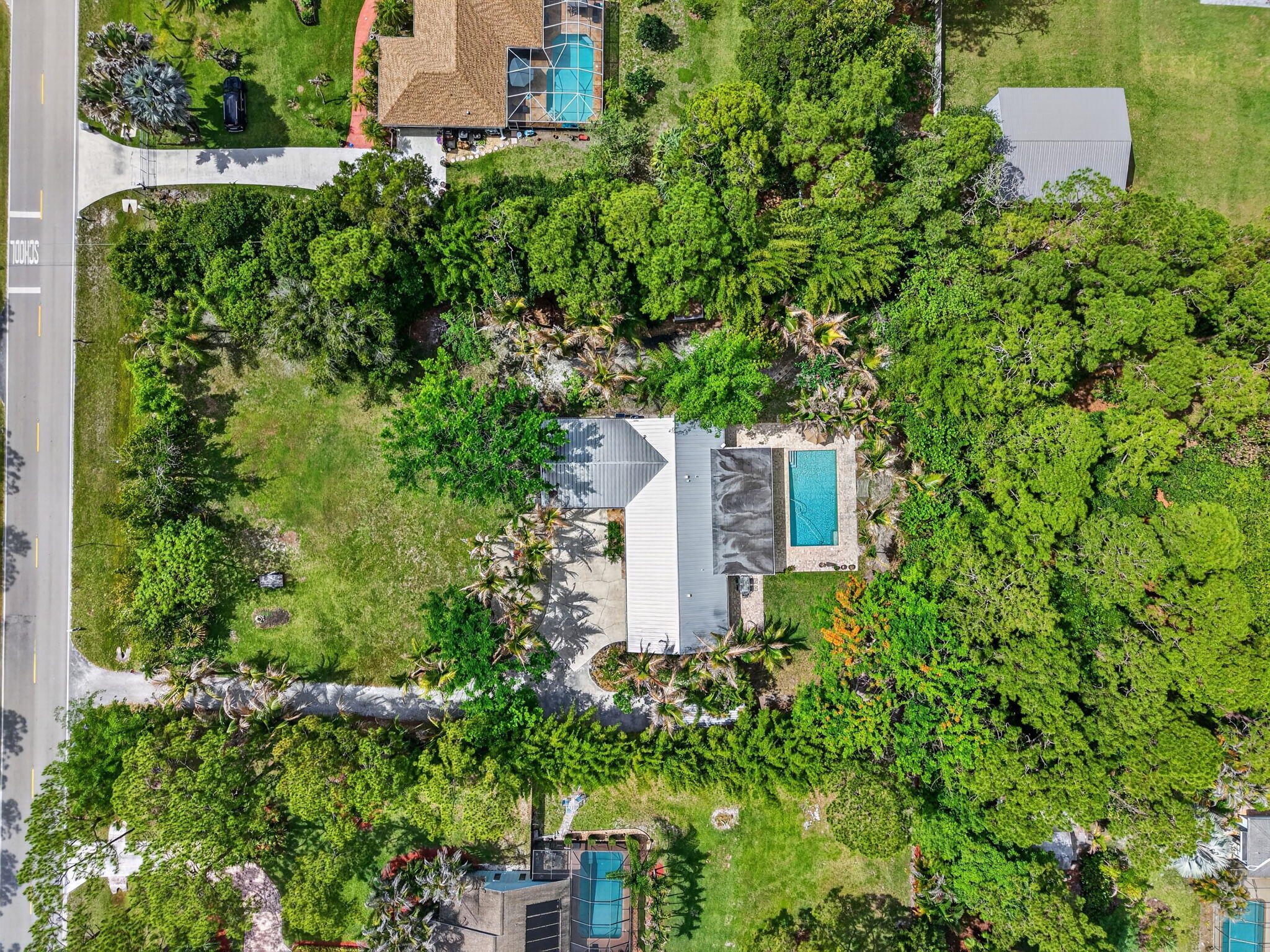 17391 Alexander Run Jupiter, FL 33478 - Photo 55 of 55 an aerial view of a house with a yard and plants