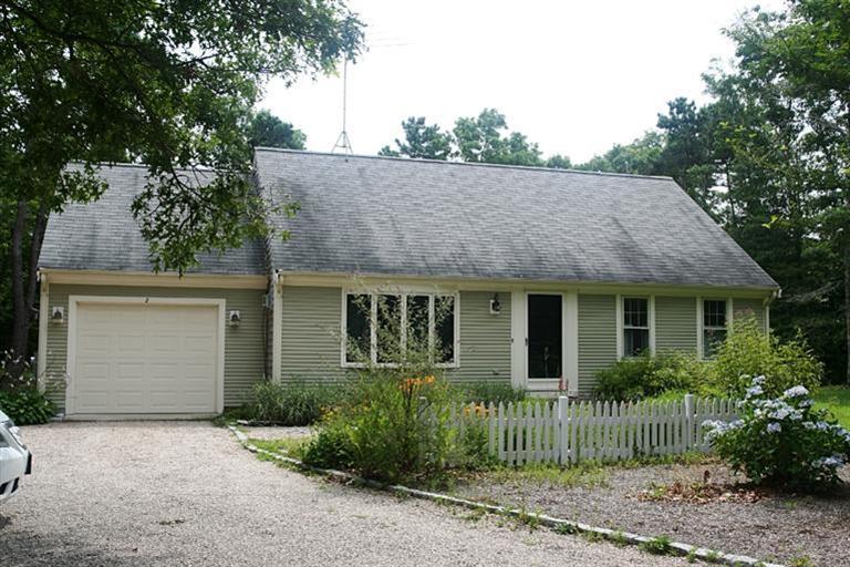 2 South Sandwich Road Mashpee, MA 02649 - Photo 1 of 7 front view of a house with a garden
