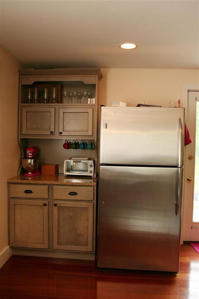 2 South Sandwich Road Mashpee, MA 02649 - Photo 3 of 7 a kitchen with a refrigerator and a stove