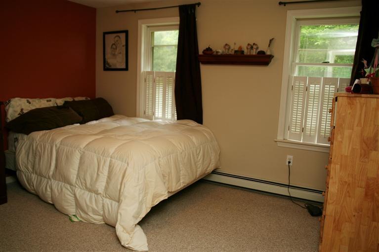 2 South Sandwich Road Mashpee, MA 02649 - Photo 7 of 7 a bed sitting in a bedroom next to a window