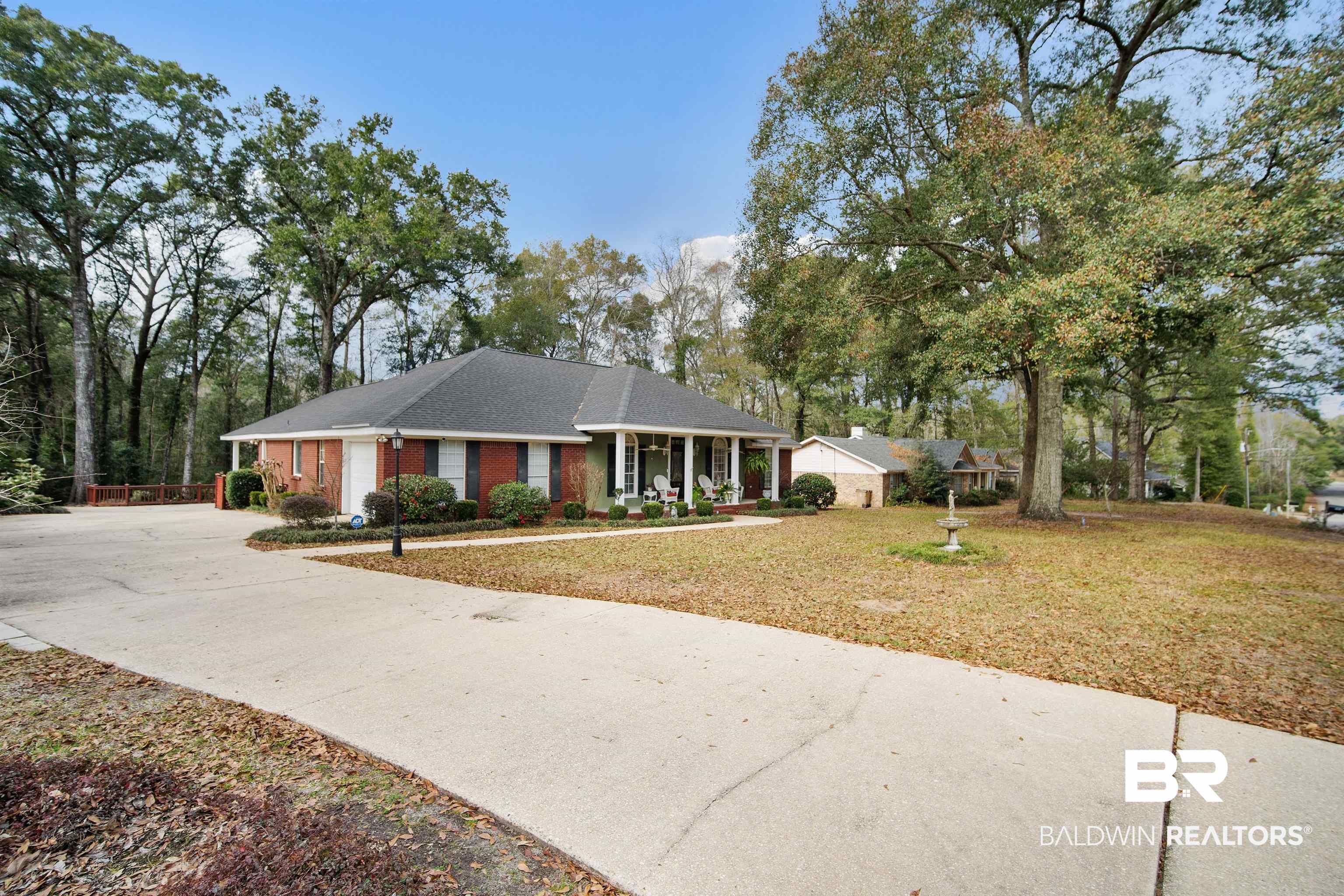 1744 Aden Road Mobile, AL 36695 - Photo 2 of 35 Ranch-style home featuring a porch and a front lawn
