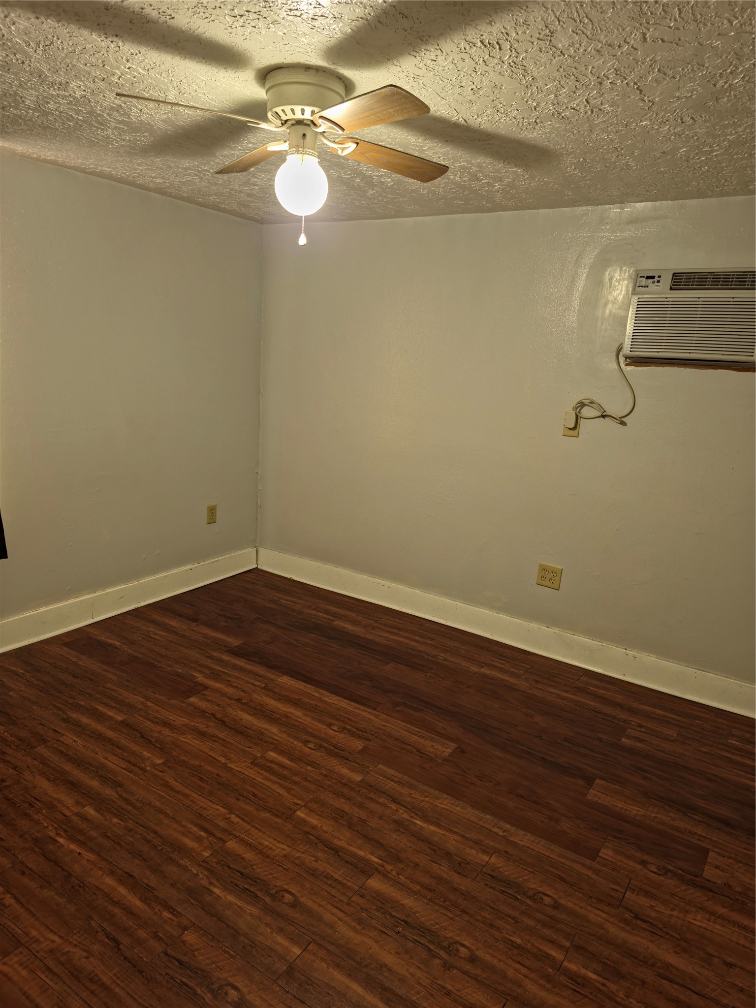 207 Moody Street, Unit 4 Houston, TX 77009 - Photo 6 of 11 a view of a room with wooden floor and fan