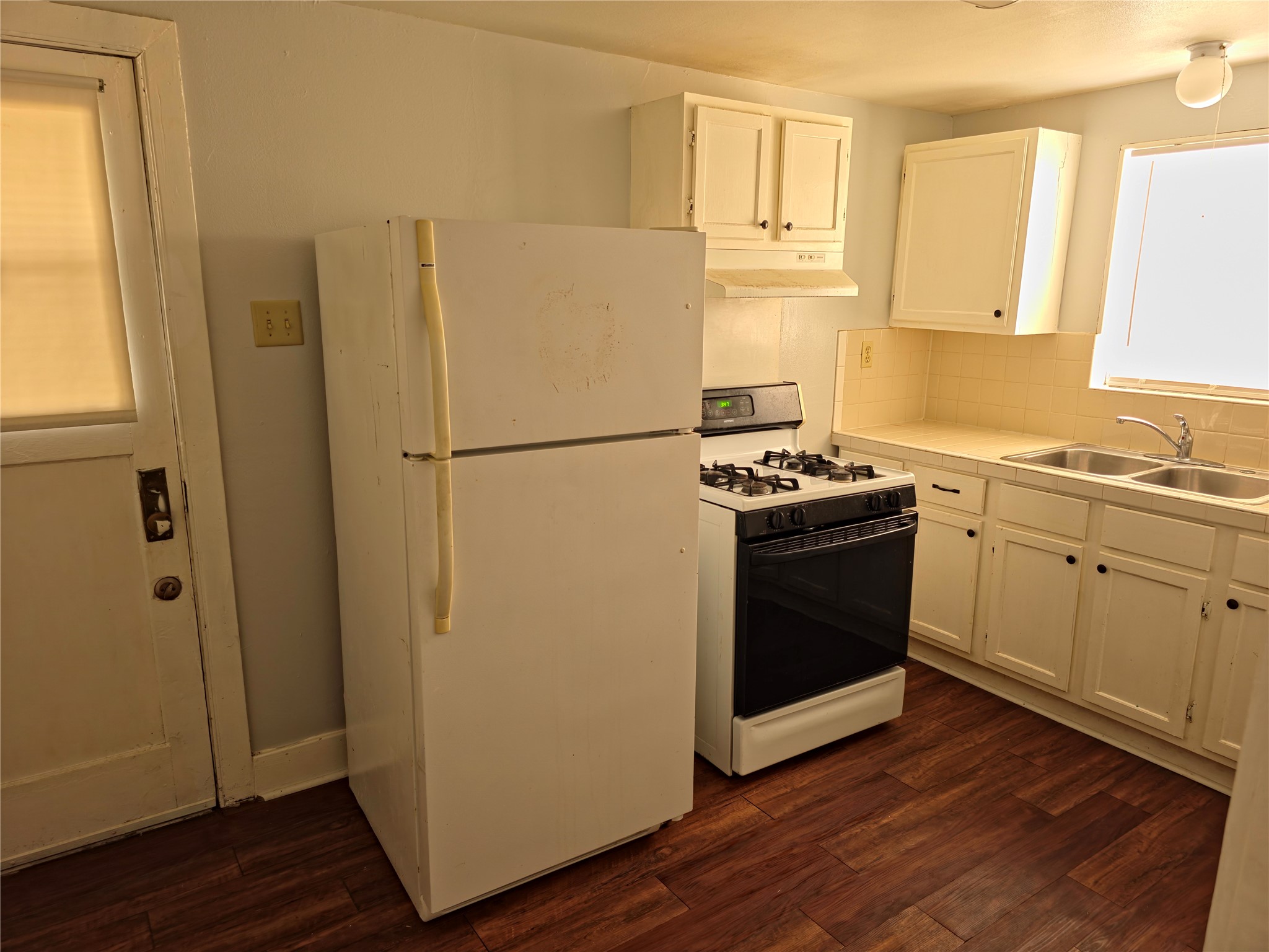 207 Moody Street, Unit 4 Houston, TX 77009 - Photo 10 of 11 a white refrigerator freezer sitting inside of a kitchen
