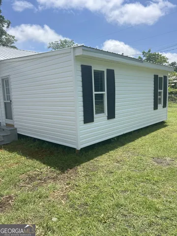 a view of a back yard of the house